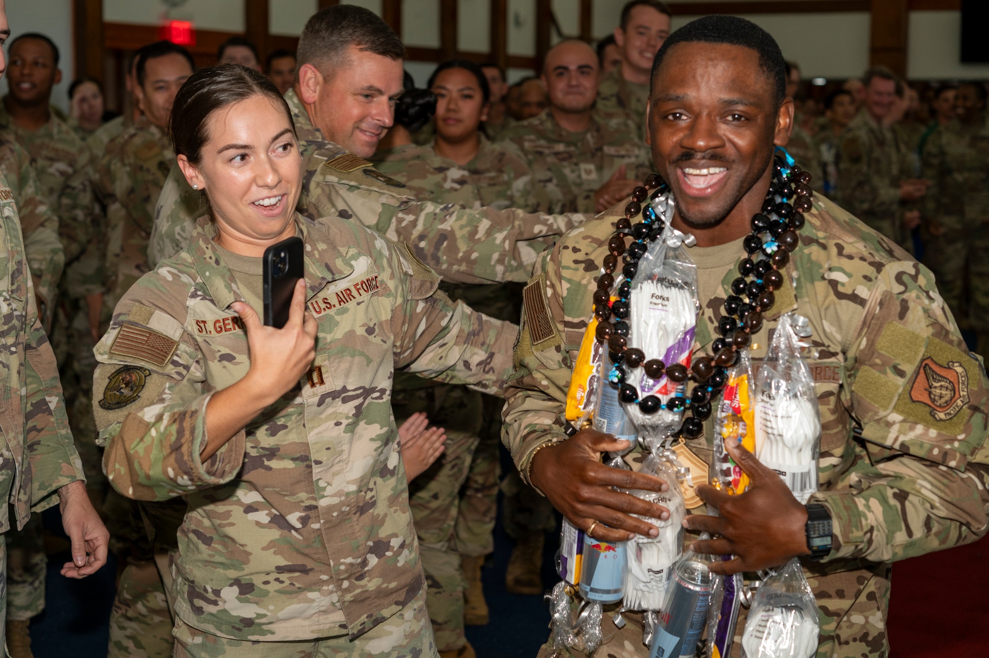 Master Sgt. Dealex Harrell, 554th Rapid Engineer Deployable Heavy Operational Repair Squadron Engineers section chief of supply, is congratulated by his wingmen during the Senior Master Sergeant Release Party at Andersen Air Force Base, Guam, Feb. 28, 2025. (U.S. Air Force photo by Airman Xavier Romero)