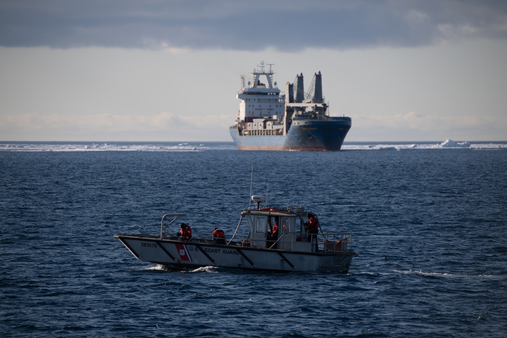 U.S. Coast Guard Cutter Polar Star’s landing craft transits Winter Quarters Bay during the escort  of M/V Ocean Giant to NSF McMurdo Station during Operation Deep Freeze, Jan. 29, 2025. Every year, a joint and total force team works together to complete Operation Deep Freeze. Active, Guard, and Reserve service members from the U.S. Air Force, Army, Coast Guard, and Navy work together to forge a strong Joint Task Force-Support Forces Antarctica (JTF-SFA) that continues the proud tradition of U.S. military support to the United States Antarctic Program. (U.S. Coast Guard photo by Petty Officer 2nd Class Briana Carter)