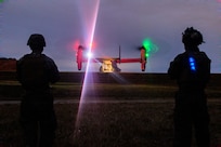 U.S. Marines with Combat Logistic Company Bravo, Combat Logistics Battalion 31, 31st Marine Expeditionary Unit, observe a U.S. Marine Corps MV-22 Osprey assigned to Marine Medium Tiltrotor Squadron (VMM) 262 (Rein.), 31st MEU, during an external lift exercise in support of Iron Fist 25, at Camp Hansen, Okinawa, Japan, Feb. 20, 2025.