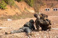 U.S. Marine Corps Cpl. Mario Salas, right, a light armored reconnaissance Marine with 1st Light Armored Reconnaissance Battalion, 1st Marine Division, clears a rifle jam from a Republic of Korea Marine Corps service member during a live-fire short bay range at Thai Reconnaissance Battalion, Sattahip, Thailand, Feb. 28, 2025.