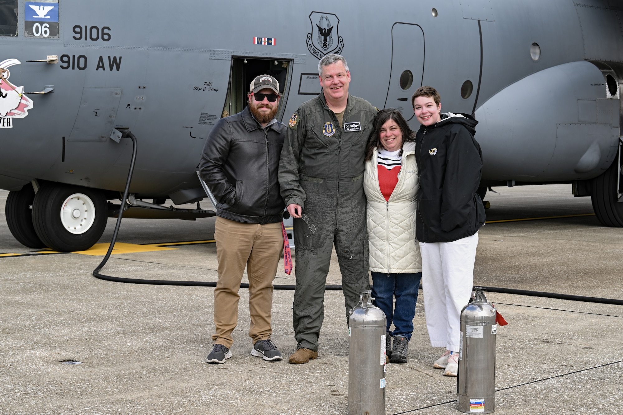 Col. Michael Maloney, 910th Airlift Wing commander, poses for a photo with his family after landing from his “fini-flight” at Youngstown Air Reserve Station, Ohio, March 2, 2025.