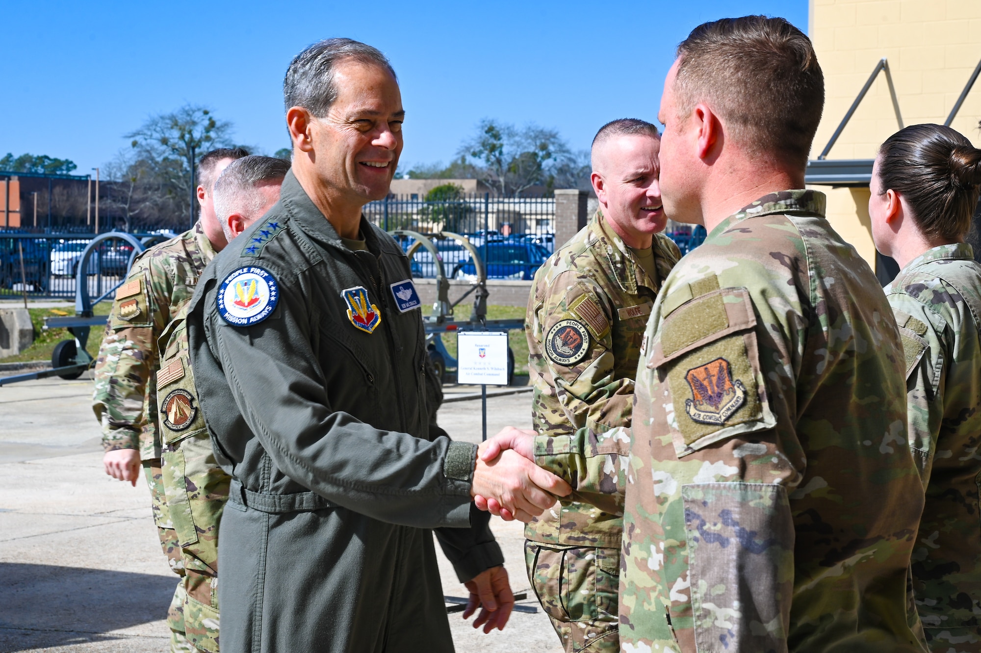 Air Force General shakes hand with an Airman