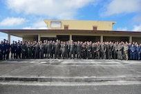 Guam March 3, 2025 – Sea Dragon 25 participants, including Maritime Patrol and Reconnaissance Aircraft (MPRA) communities from the Royal Australian Air Force (RAAF), Japan Maritime Self-Defense Force (JMSDF), Republic of Korea Navy (ROKN), and the United States Navy, pose for a group photo during opening ceremony and exercise commencement.