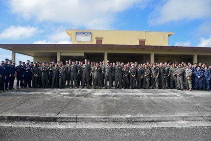 Guam March 3, 2025 – Sea Dragon 25 participants, including Maritime Patrol and Reconnaissance Aircraft (MPRA) communities from the Royal Australian Air Force (RAAF), Japan Maritime Self-Defense Force (JMSDF), Republic of Korea Navy (ROKN), and the United States Navy, pose for a group photo during opening ceremony and exercise commencement.