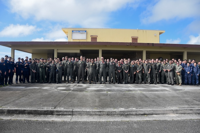 Guam March 3, 2025 – Sea Dragon 25 participants, including Maritime Patrol and Reconnaissance Aircraft (MPRA) communities from the Royal Australian Air Force (RAAF), Japan Maritime Self-Defense Force (JMSDF), Republic of Korea Navy (ROKN), and the United States Navy, pose for a group photo during opening ceremony and exercise commencement.
