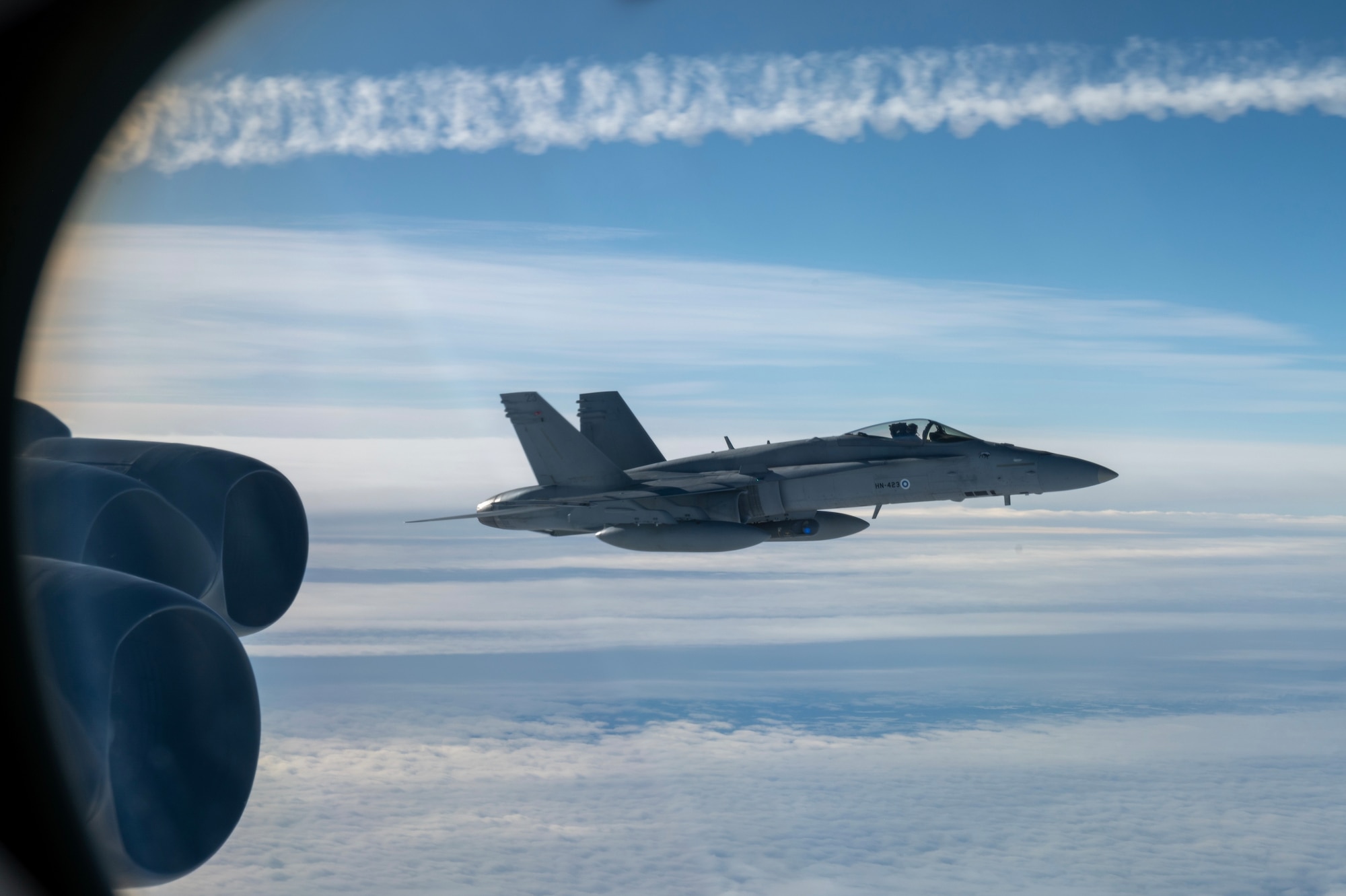 A Finnish Air Force F/A-18C Hornet integrates with a U.S. Air Force B-52H Stratofortress aircraft in support of Bomber Task Force 25-2 mission FORTRESS HAIL on March 06, 2025. Bomber Task Force missions like FORTRESS HAIL demonstrate the ability to integrate seamlessly with mission partners, strengthening readiness and lethality.  (U.S. Air Force photo by Senior Airman Brooklyn Golightly)