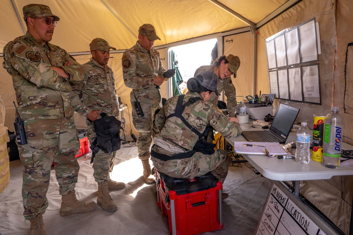 Members of the 162nd Wing Fatality Search and Recovery Team gather during the Nevada Chemical, Biological, Radiological, Nuclear Enhanced Response Force Package Sustainment Year Combined Training Event at Nellis Air Force Base, Mar. 1, 2025. The 162nd FSRT can be activated to provide support anywhere within the Unitd States as an emergency as part of the CERFP, or as a standalone group directly supporting requesting agencies. (U.S,. Air National Guard photo by Tech. Sgt. Van Whatcott)