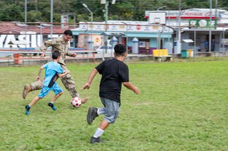U.S. Army Spc. Jaden King, Joint Task Force-Bravo 349th Medical Detachment medic, plays soccer with local children during a Medical Readiness Training Exercise in Pejibaye, Costa Rica, February 25, 2025.