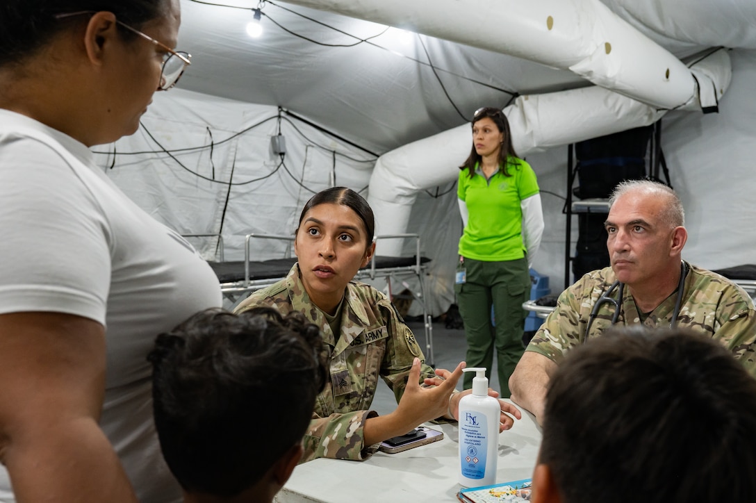 U.S. Army Sgt. Giselle Aguilar, Joint Task Force-Bravo 349th Medical Detachment medic, and Col. Lance Weagant, JTF-Bravo 349th Medical Detachment medical provider, speak with a patient during a Medical Readiness Training Exercise in Pejibaye, Costa Rica, February 25, 2025.
