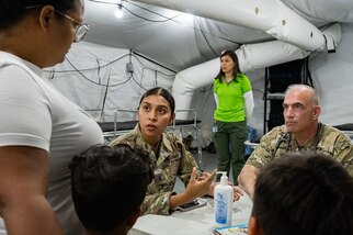 U.S. Army Sgt. Giselle Aguilar, Joint Task Force-Bravo 349th Medical Detachment medic, and Col. Lance Weagant, JTF-Bravo 349th Medical Detachment medical provider, speak with a patient during a Medical Readiness Training Exercise in Pejibaye, Costa Rica, February 25, 2025.