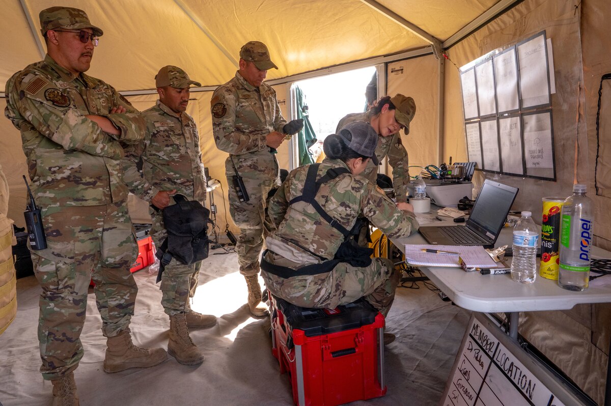 Members of the 162nd Wing Fatality Search and Recovery Team gather during the Nevada Chemical, Biological, Radiological, Nuclear Enhanced Response Force Package Sustainment Year Combined Training Event at Nellis Air Force Base, Mar. 1, 2025. The 162nd FSRT can be activated to provide support anywhere within the Unitd States as an emergency as part of the CERFP, or as a standalone group directly supporting requesting agencies. (U.S,. Air National Guard photo by Tech. Sgt. Van Whatcott)