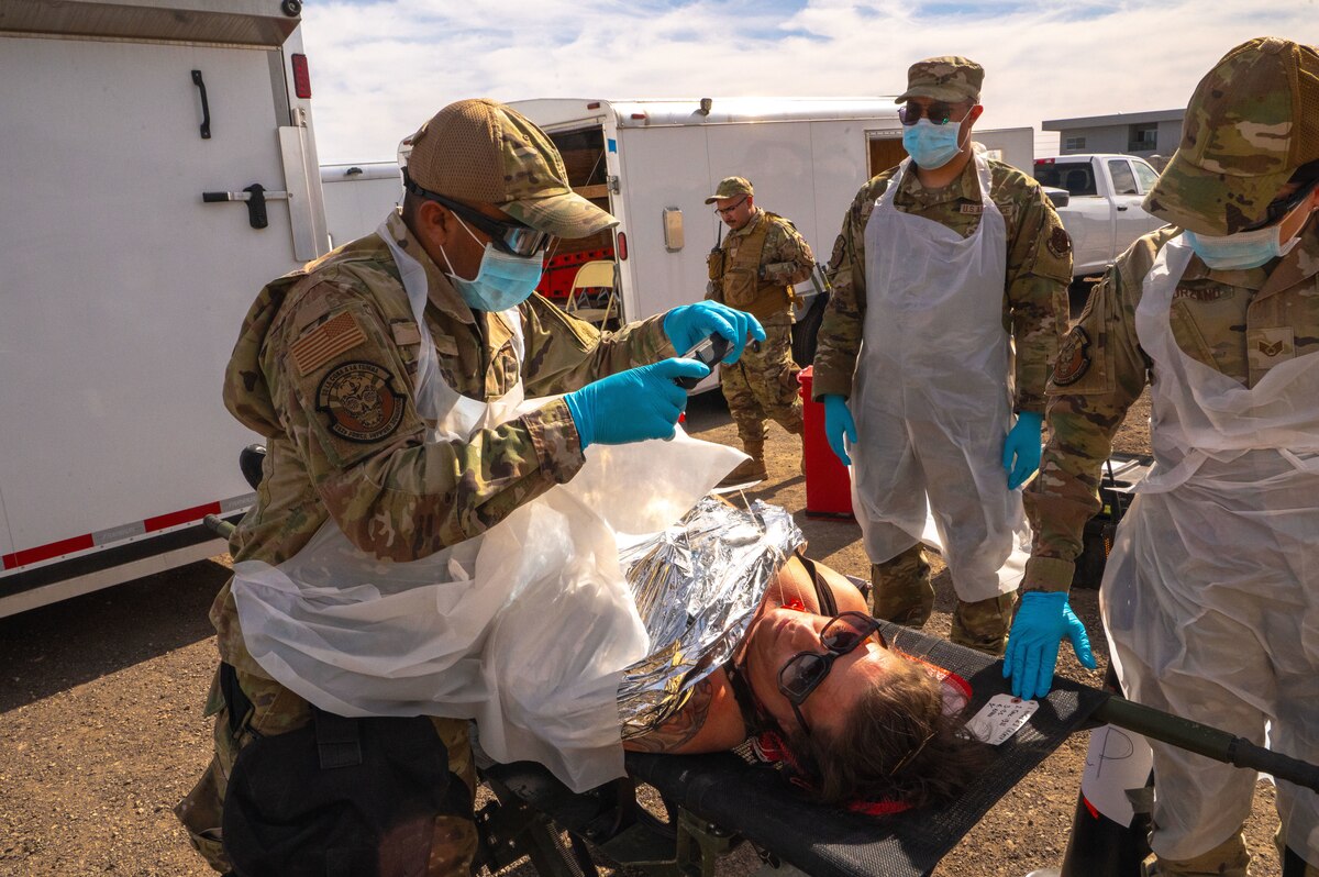 Members of the 162nd Wing Fatality Search and Recovery Team document remains during the Nevada Chemical, Biological, Radiological, Nuclear Enhanced Response Force Package Sustainment Year Combined Training Event at Nellis Air Force Base, Mar. 1, 2025. Joint exercises, such as the Nevada CBRN CERFP SYCTE enable 162nd Services Airmen to fulfill a specific role in supporting members of the community in times of disaster as part of the FSRT. (U.S,. Air National Guard photo by Tech. Sgt. Van Whatcott)