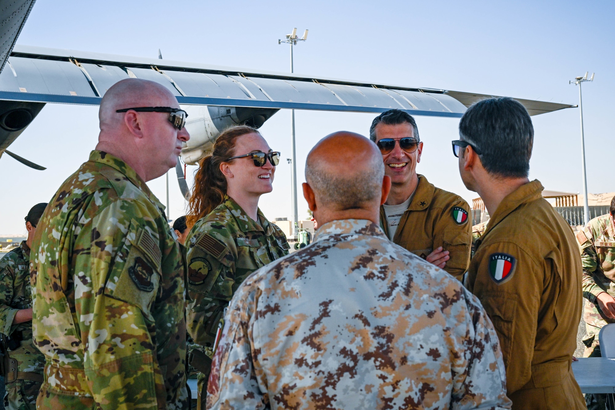 People in uniform speak with eachother.