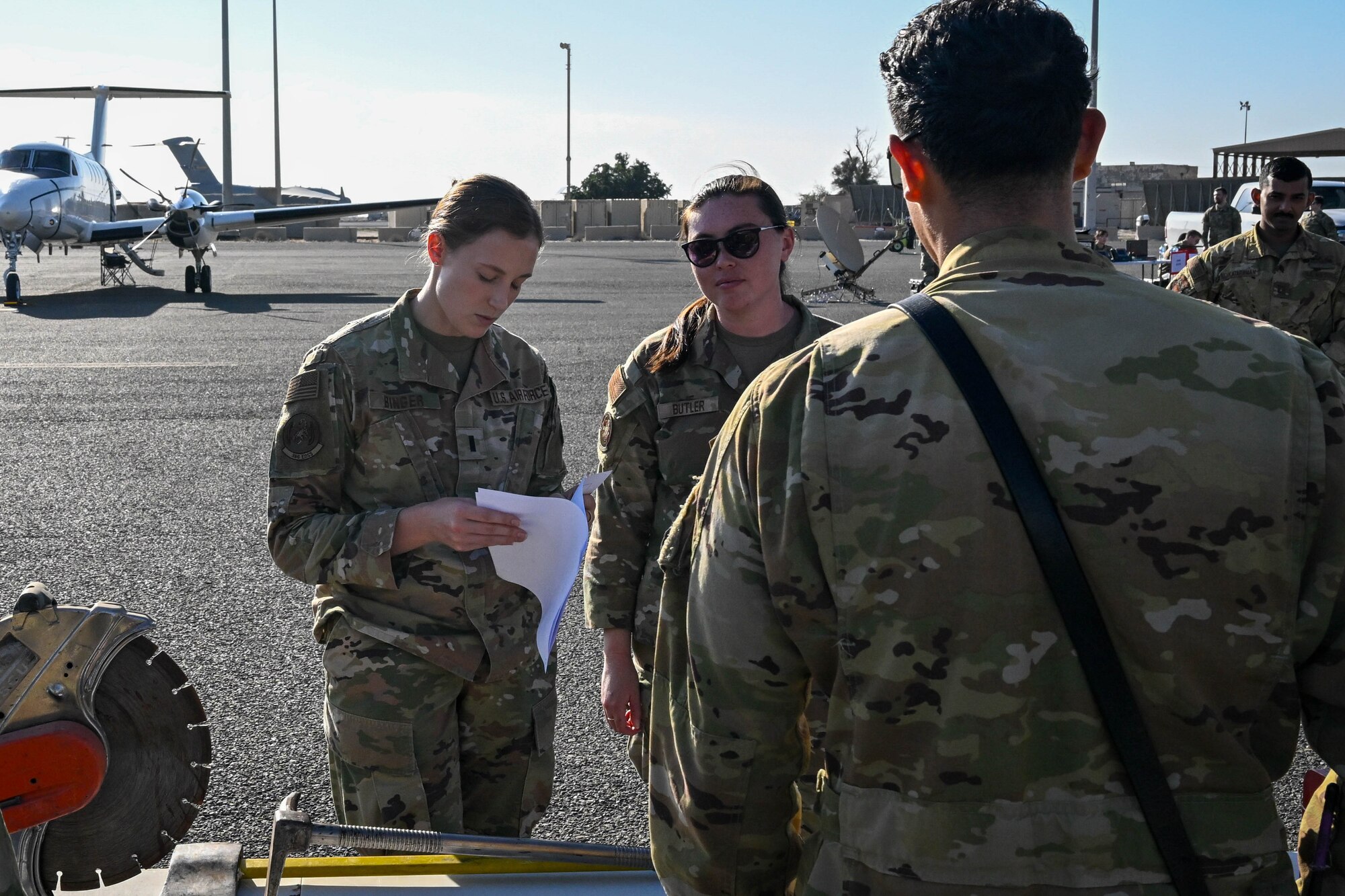 People in uniform talk with eachother.