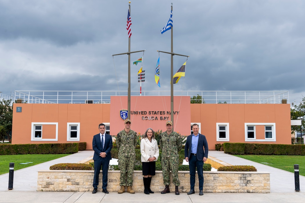 From left to right, Christopher Dostal, deputy political counselor, U.S. Embassy Athens; Cmdr. Steven Aspholm, executive officer, Naval Support Activity Souda Bay; Maria Olson, Chargé d'Affaires, U.S. Embassy Athens; Capt. Stephen Steacy, commanding officer, NSA Souda Bay; and Capt. Mark Imblum, defense attaché, U.S. Embassy Athens, pose for a group photo onboard NSA Souda Bay, Crete, Greece, on March. 4, 2025.