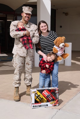 From left to right: Staff Sgt. Tyson Goolsby, and Elijah, Asher, and Nicole Goolsby, attend a special ceremony on March 1, 2025, in which California Assemblyman Tom Lackey presented the Goolsby family with a certificate and a teddy bear, recognizing the significance of Elijah Goolsby being the first baby born at Naval Hospital Twentynine Palms in 2025 and the 2nd baby born in the Hi-Desert Region in 2025.