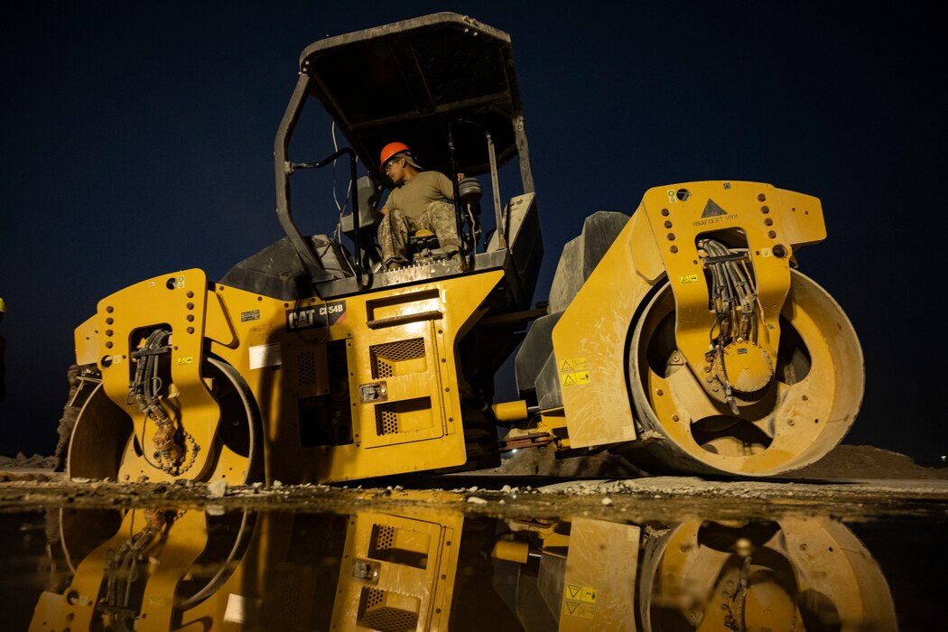 Steamroller smoothing asphalt
