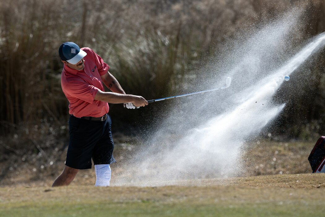 Golfer swinging club