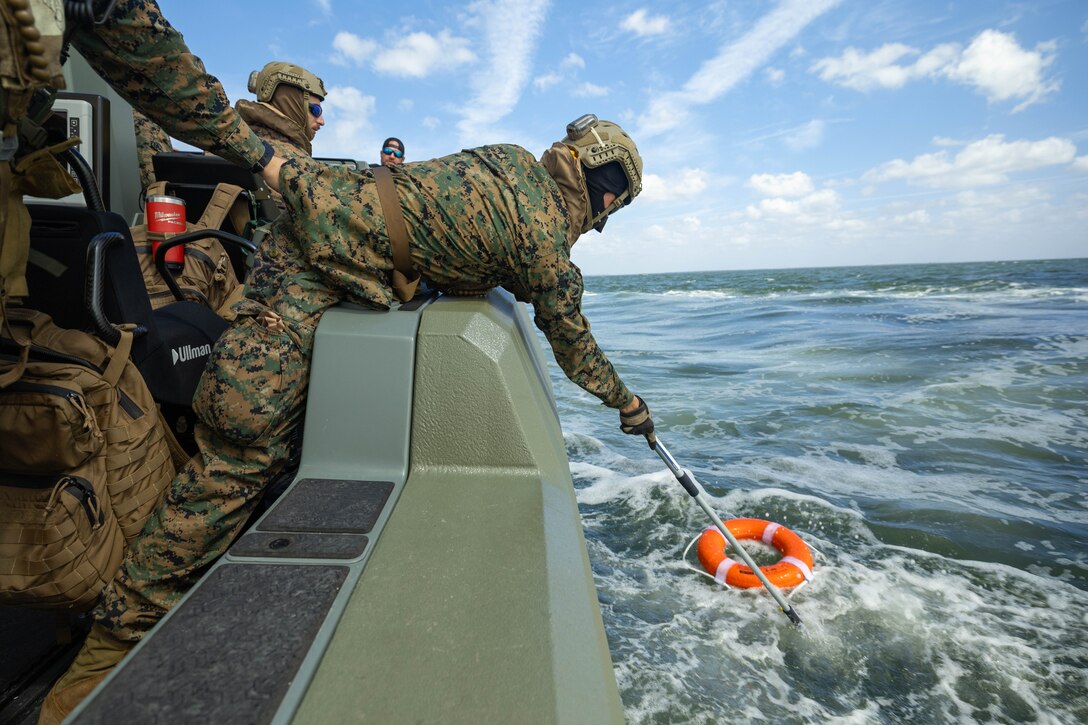 U.S. Marine Corps Lance Cpl. Dante Johnson, assault amphibious vehicle technician, 4th Assault Amphibian Battalion, 4th Marine Division, Marine Forces Reserve, conducts retrieval operations on a multi-mission reconnaissance craft–alpha variant, Tampa, Florida, March 4, 2025. The MMRC-A will enable Marines with 4th AABn to continue to train and operate in the maritime domain, supporting service level littoral maneuver concept development efforts. (U.S. Marine Corps photo by Lance Cpl. Van Hoang)