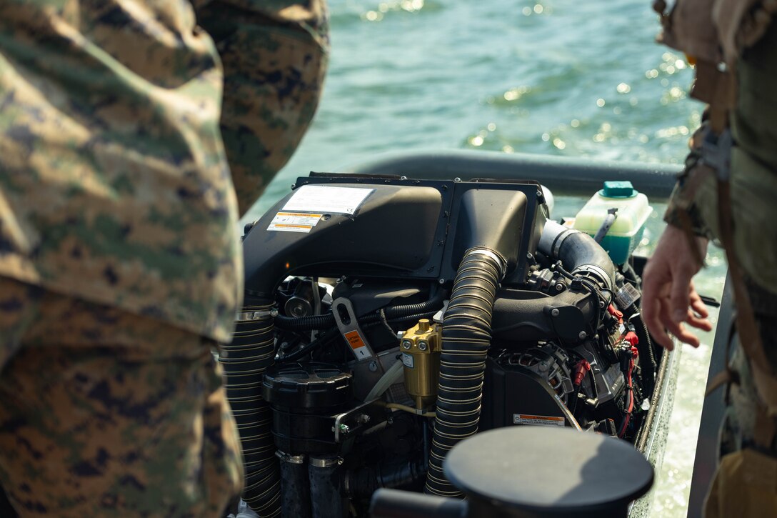 U.S. Marines Corps Gunnery Sgt. Joshua Kelly (left), and Gunnery Sgt. Jared Lingle, assault amphibious crewmen, 4th Assault Amphibian Battalion, 4th Marine Division, Marine Forces Reserve, inspect an engine on a multi-mission reconnaissance craft–alpha variant–after conducting high-speed, open water maneuvers, Tampa, Florida, March 4, 2025. The MMRC-A will enable Marines with 4th AABn to continue to train and operate in the maritime domain, supporting service level littoral maneuver concept development efforts. (U.S. Marine Corps photo by Lance Cpl. Van Hoang)