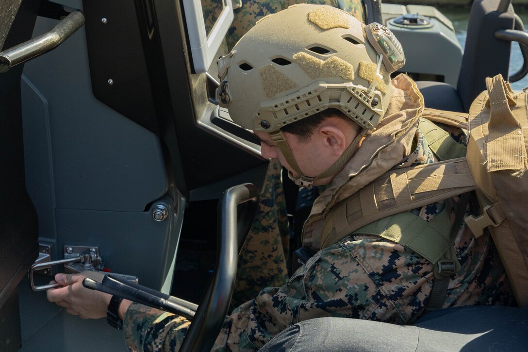 U.S. Marine Corps Cpl. Luke Barlow, assault amphibious vehicle crewman, 4th Assault Amphibian Battalion, 4th Marine Division, Marine Forces Reserve, secures the mast of a multi-mission reconnaissance craft–alpha variant–before conducting high-speed, open water maneuvers, Tampa, Florida, March 4, 2025. The MMRC-A will enable Marines with 4th AABn to continue to train and operate in the maritime domain, supporting service level littoral maneuver concept development efforts. (U.S. Marine Corps photo by Lance Cpl. Van Hoang)