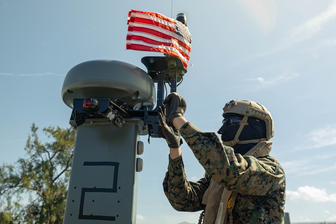 Lance Cpl. Dante Johnson, assault amphibious vehicle technician, 4th Assault Amphibian Battalion, 4th Marine Division, Marine Forces Reserve, secures the mast of a multi-mission reconnaissance craft–alpha variant–before conducting high-speed, open water maneuvers, Tampa, Florida, March 4, 2025. The MMRC-A will enable Marines with 4th AABn to continue to train and operate in the maritime domain, supporting service level littoral maneuver concept development efforts. (U.S. Marine Corps photo by Lance Cpl. Van Hoang)