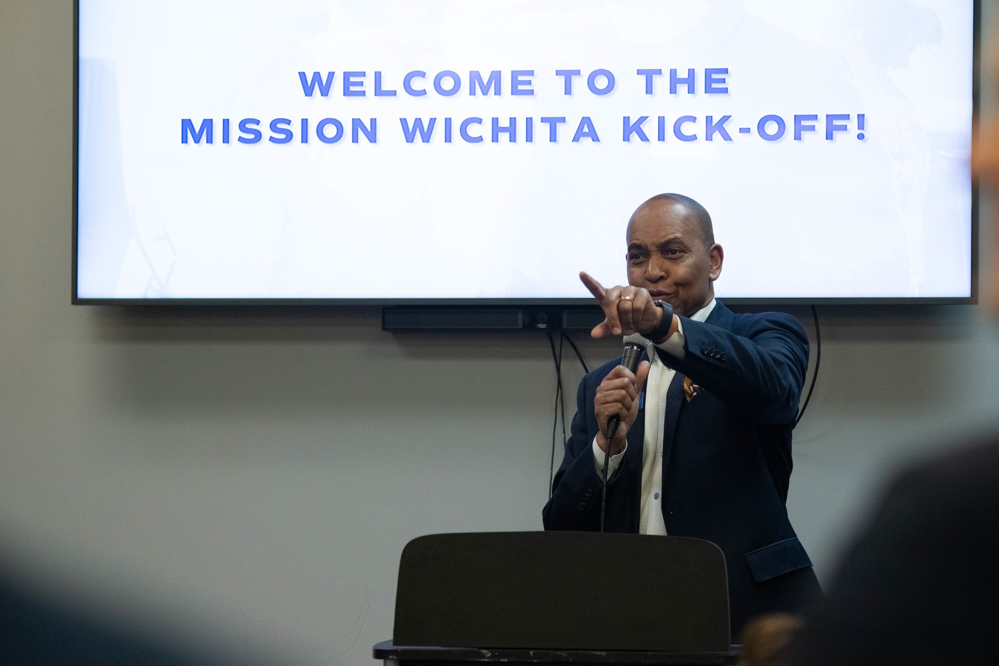 John Rolfe, president and CEO of the Wichita Regional Chamber of Commerce, opens for a series of Mission Wichita presenters at the Kansas Aviation Museum in Wichita, Kansas, March 4, 2025. Mission Wichita is a program that connects McConnell Airmen and Wichita locals to reinforce the relationship between the military young professionals within the community. (U.S. Air Force photo by Airman 1st Class Patrick O'Neill)