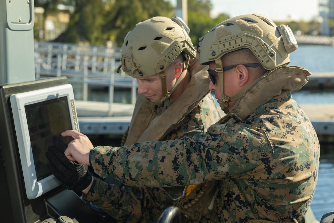 U.S. Marine Corps Staff Sgt. Ijinio Centeno (left), assault amphibious vehicle technician, and Cpl. Jordan Minaca, assault amphibious vehicle commander, with 4th Assault Amphibian Battalion, 4th Marine Division, Marine Forces Reserve, check the instruments of a multi-mission reconnaissance craft–alpha variant–to ensure the engines are properly functioning before heading out to sea, Tampa, Florida, March 3, 2025. The MMRC-A will enable Marines with 4th AABn to continue to train and operate in the maritime domain, supporting service level littoral maneuver concept development efforts. (U.S. Marine Corps photo by Lance Cpl. Van Hoang)