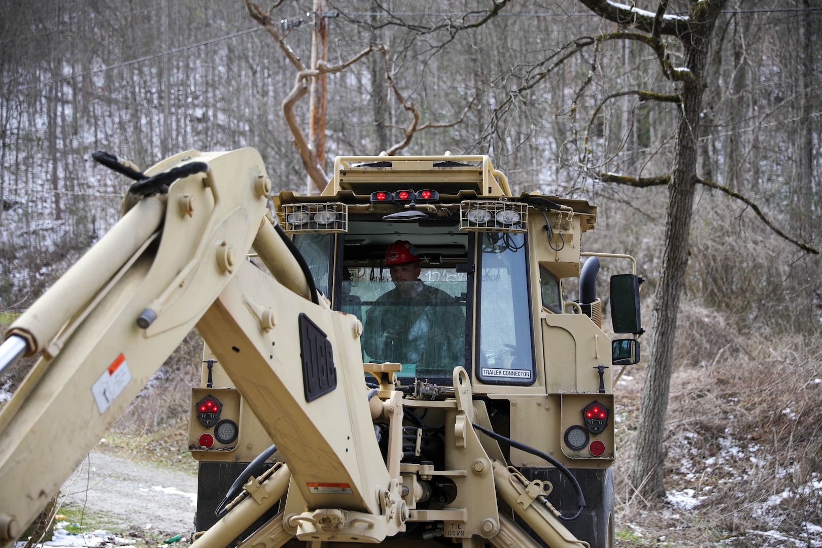 Kentucky National Guard Soldiers from the 207th Engineer Construction Company, 149th Maneuver Enhancement Brigade, aided in flood relief efforts in Leslie County Feb. 22, 2025. They cleared and reconstructed roads.