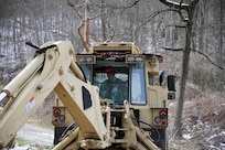 Kentucky National Guard Soldiers from the 207th Engineer Construction Company, 149th Maneuver Enhancement Brigade, aided in flood relief efforts in Leslie County Feb. 22, 2025. They cleared and reconstructed roads.