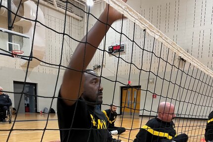 Master Sgt. Earlie Brown during sitting volleyball practice at an adaptive sports camp.