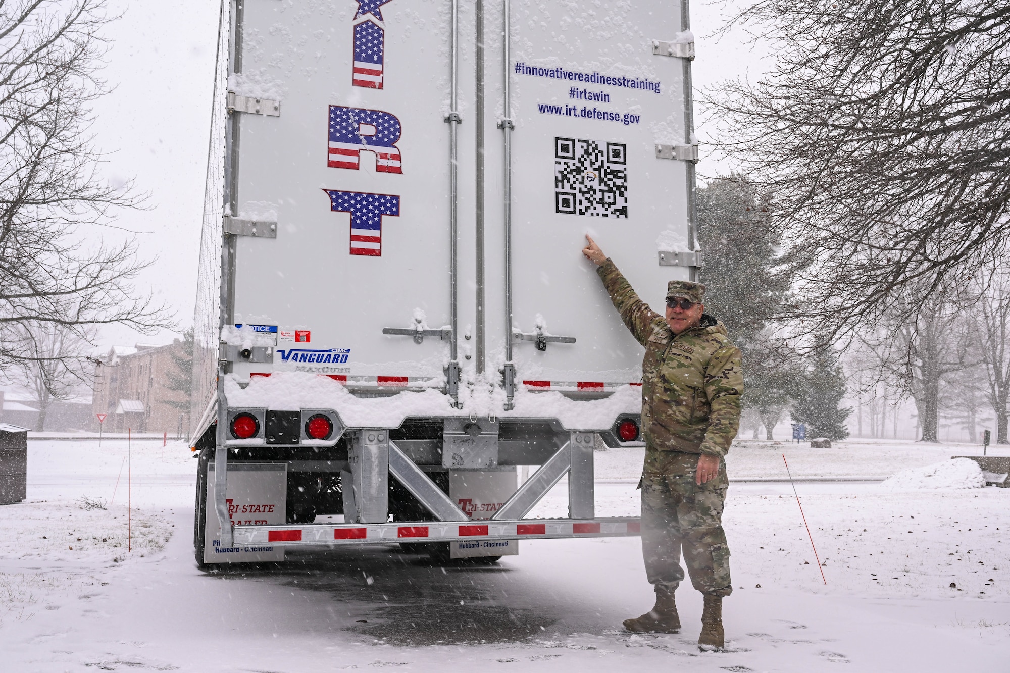 Master Sgt. Dale Payne, NCOIC of civil engineering and force support with the Department of Defense’s Innovative Readiness Program Combined Asset Management Site, points to a QR code on one of the IRT trailers that he’s hauled for thousands of miles, March 2, 2025.