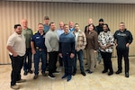 Group of people pose for a photo.