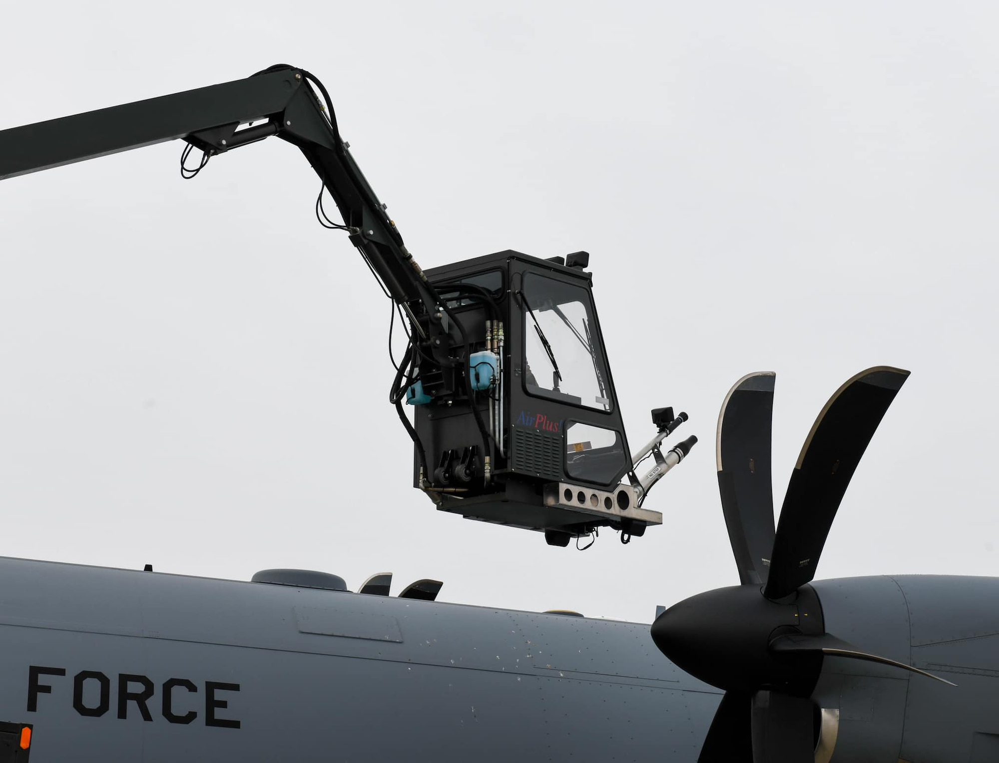 Maintainers from the 910th Maintenance Squadron remove snow from a C-130J Super Hercules aircraft to prepare it for flight, Jan. 17, 2025, at Youngstown Air Reserve Station, Ohio.