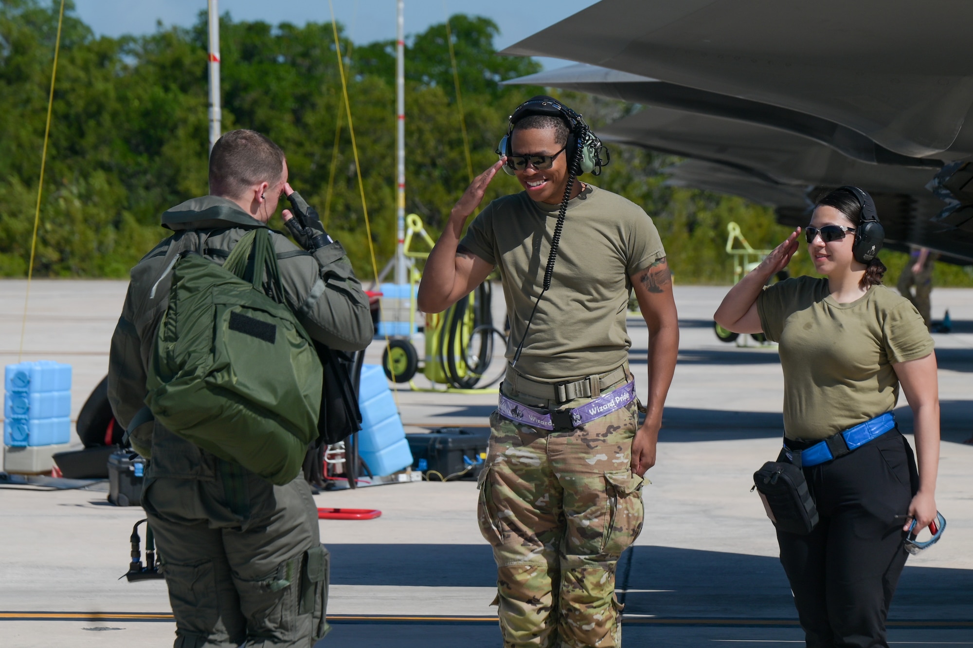 A photo of Airmen saluting.