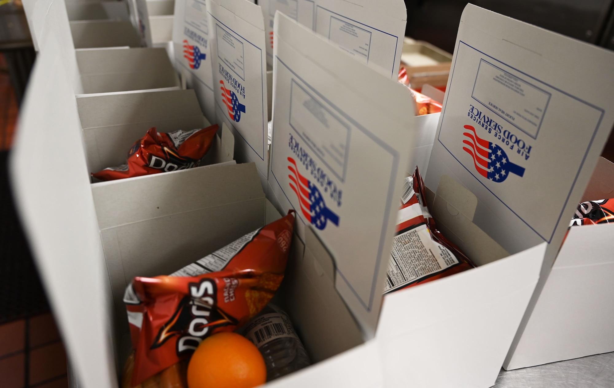 Box lunches sit on counter