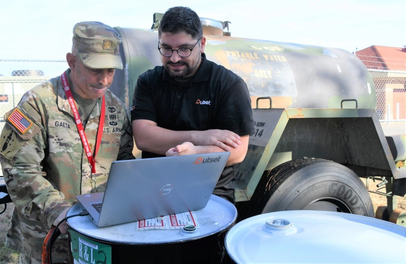 Dr. Robert Gaeta, Chief of Nephrology at Womack Army Medical Center (L) reads over data as a mock dialysis takes place on the Womack campus