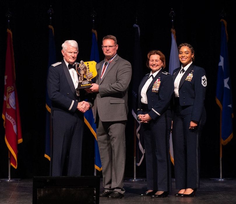 Sean Gibbons, 17th Security Forces Squadron indexing compliance manager, is awarded the Civilian Supervisory Category II award during the 2024 Annual Awards Ceremony at Murphey Performance Hall, San Angelo, Texas, Feb. 29, 2025. Recognizing the achievements of top performing personnel boosts wing and unit morale, while encouraging them to strive for continuous improvement and excellence. (U.S. Air Force photo by Airman 1st Class Brian Lummus)