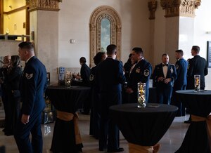 Attendees mingle during the social hour before the 2024 Annual Awards Ceremony at Murphey Performance Hall, San Angelo, Texas,  Feb. 29, 2025. A social hour took place between the medallion ceremony and awards ceremony to give attendees a chance to get refreshments and prepare for the rest of the night. (U.S. Air Force photo by Airman 1st Class Brian Lummus)