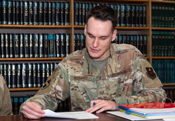 U.S. Air Force Staff Sgt. Elijah Wiegand, 42nd Air Base Wing Judge Advocate training and readiness non-commissioned officer in charge, verify documents at Maxwell Air Force Base, Alabama, March 03, 2025.