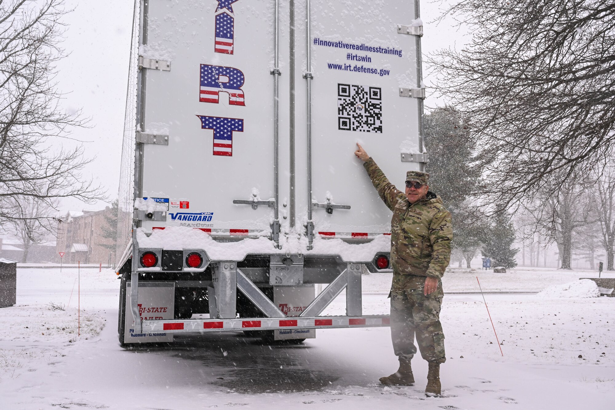 Master Sgt. Dale Payne, NCOIC of civil engineering and force support with the Department of Defense’s Innovative Readiness Program Combined Asset Management Site, points to a QR code on one of the IRT trailers that he’s hauled for thousands of miles, March 2, 2025.