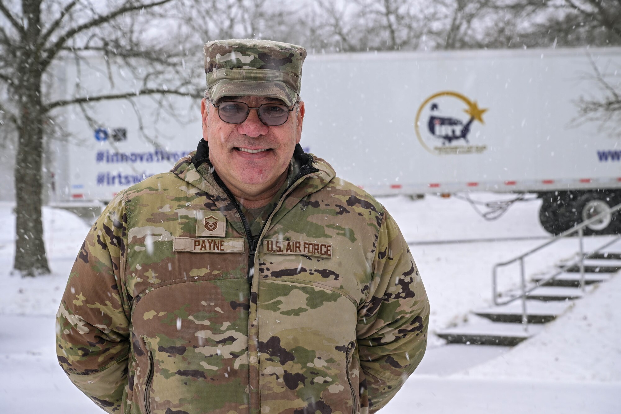 Master Sgt. Dale Payne, NCOIC of civil engineering and force support with the Department of Defense’s Innovative Readiness Program Combined Asset Management Site, poses for a photo in front of one of the IRT trailers that he’s hauled for thousands of miles, March 2, 2025.