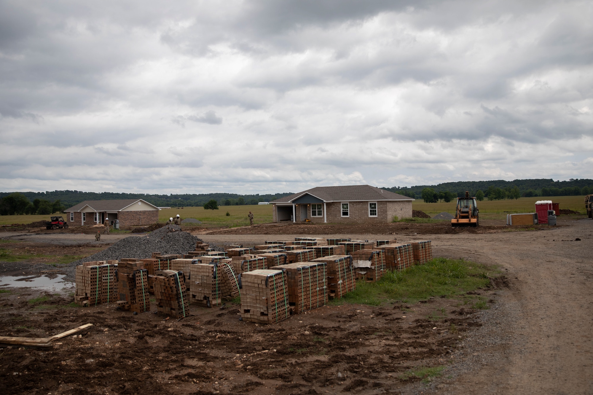 National Guard Soldiers and Airmen work jointly building seven houses at the Innovative Readiness Training construction site in Tahlequah, Oklahoma, June 6, 2022.
