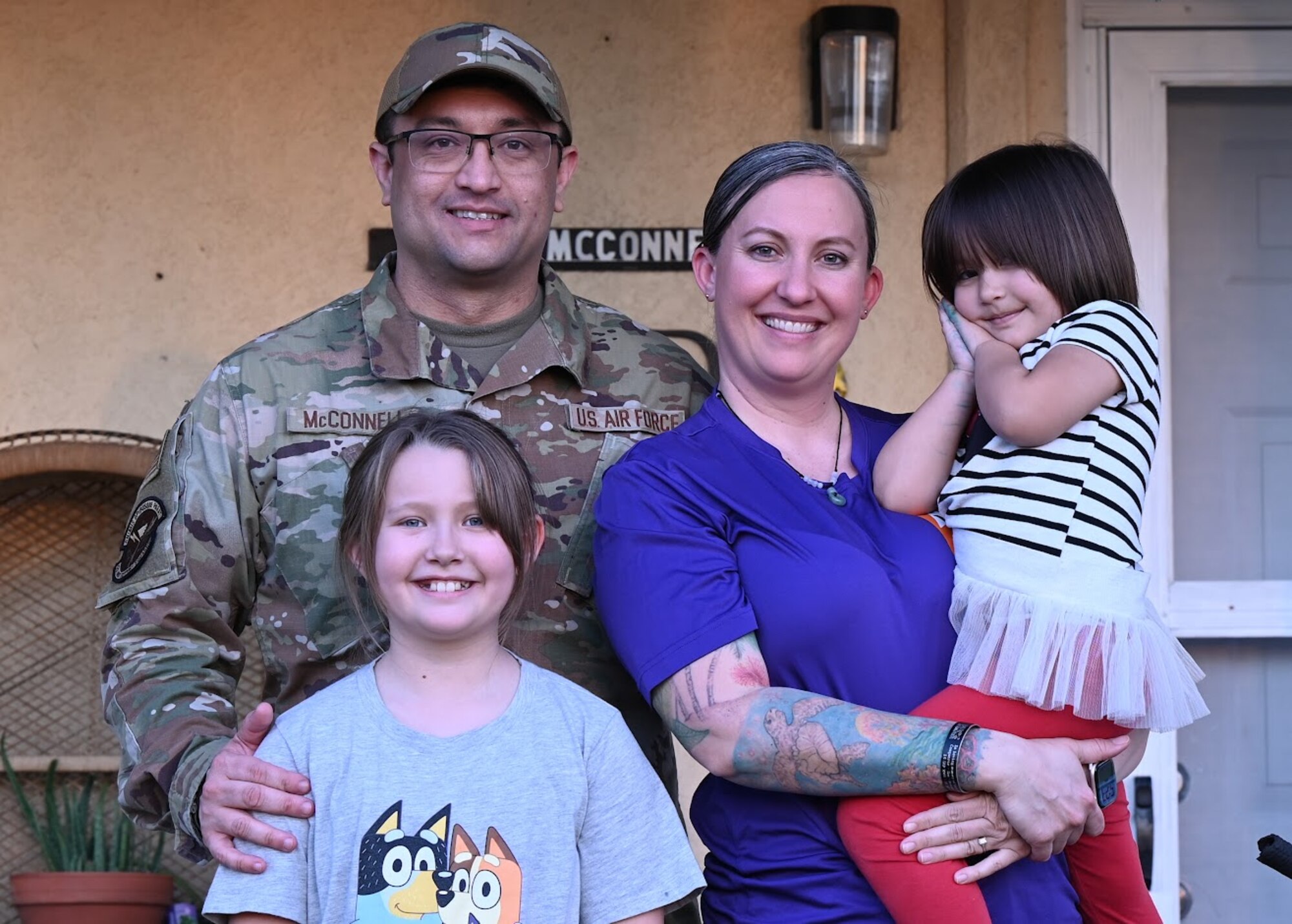 U.S. Air Force Master Sgt. Ryan McConnell, 42nd Force Support Squadron Airman Leadership School commandant, and his spouse, Tech. Sgt. Kathleen McConnell, Force Support Professional Development School master resilience trainer course instructor, pose for a photograph with their two daughters, Adelaide Keawe McConnell, left, and Effie Narumi McConnell, right, at Maxwell Air Force Base, Alabama, Feb. 26, 2025.