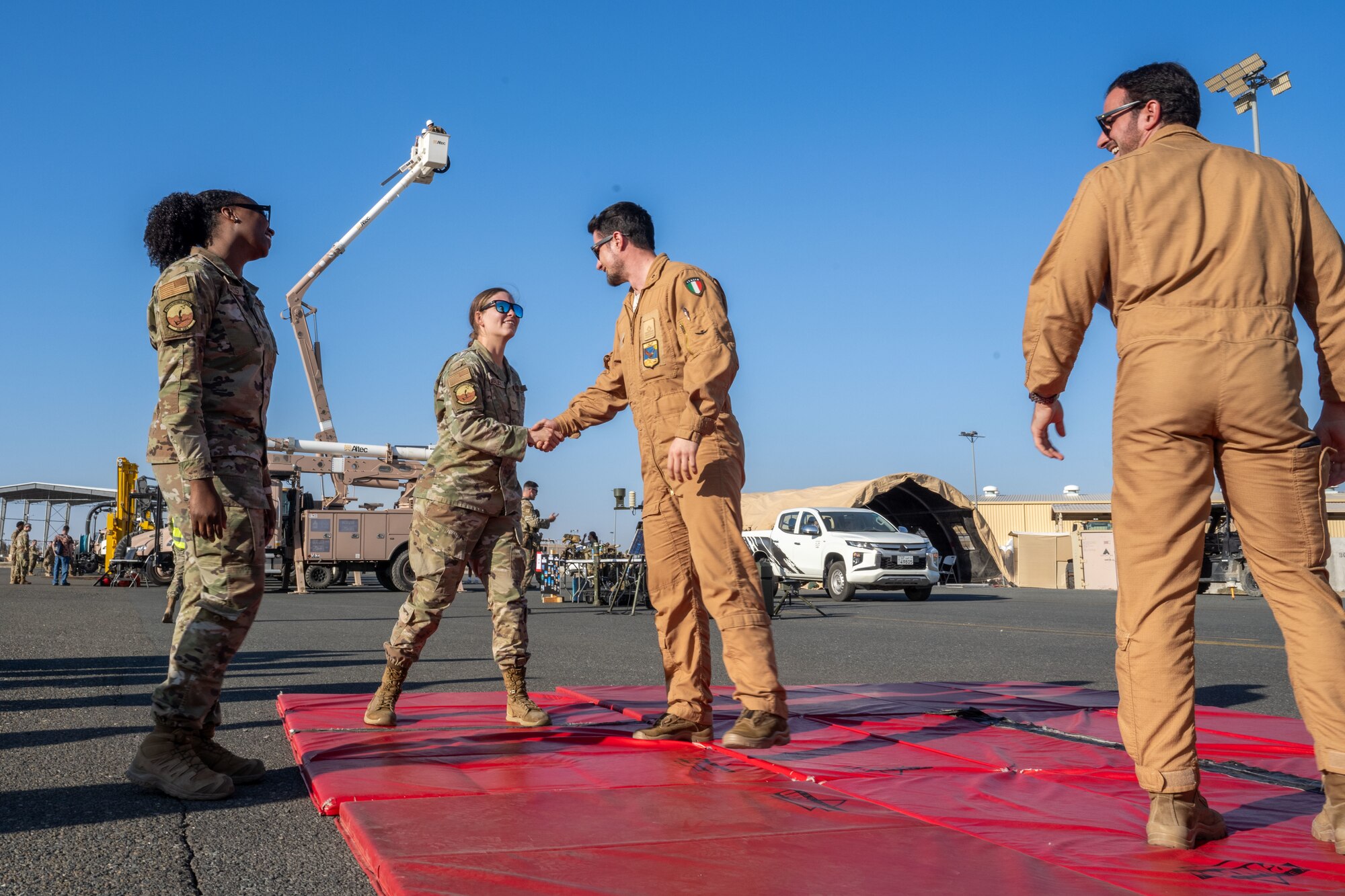 U.S. and Italian service members interact at an Air expo.