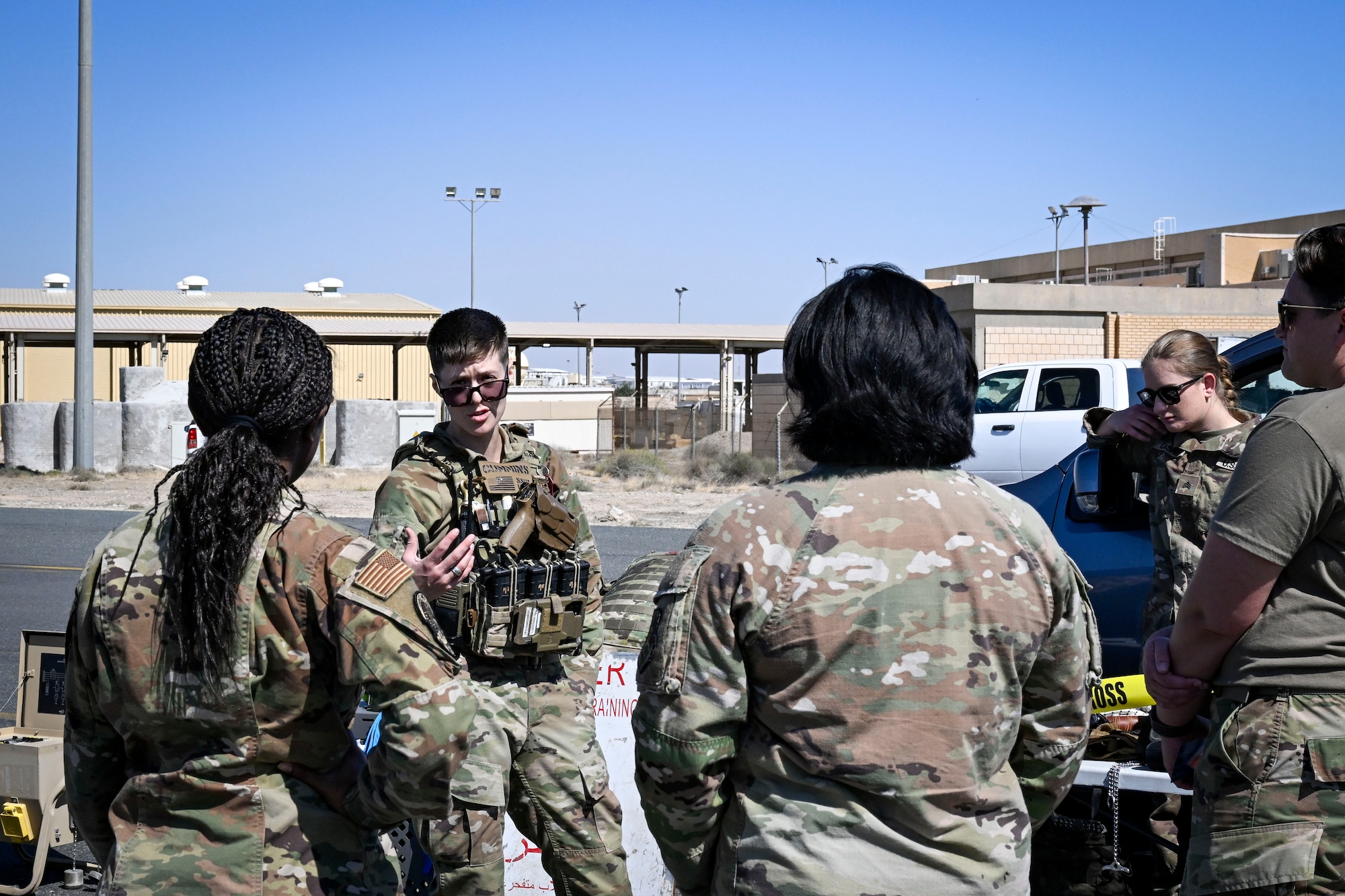People in uniform conversate.