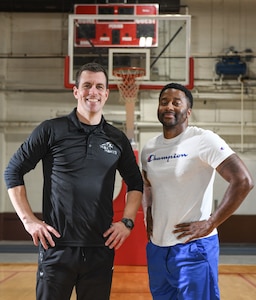 Capt. Christopher Cook, Head Coach, and Master Sgt. Derrick Raley, Team Mentor, pose for a photo at the Offutt Air Force Base Field House on March 6, 2025. Cook and Raley have been instrumental in turning the Warhawks basketball program around. (U.S. Air Force photo by Chad Watkins)
