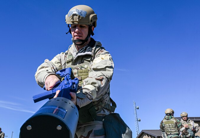An Airman clears a training rifle.