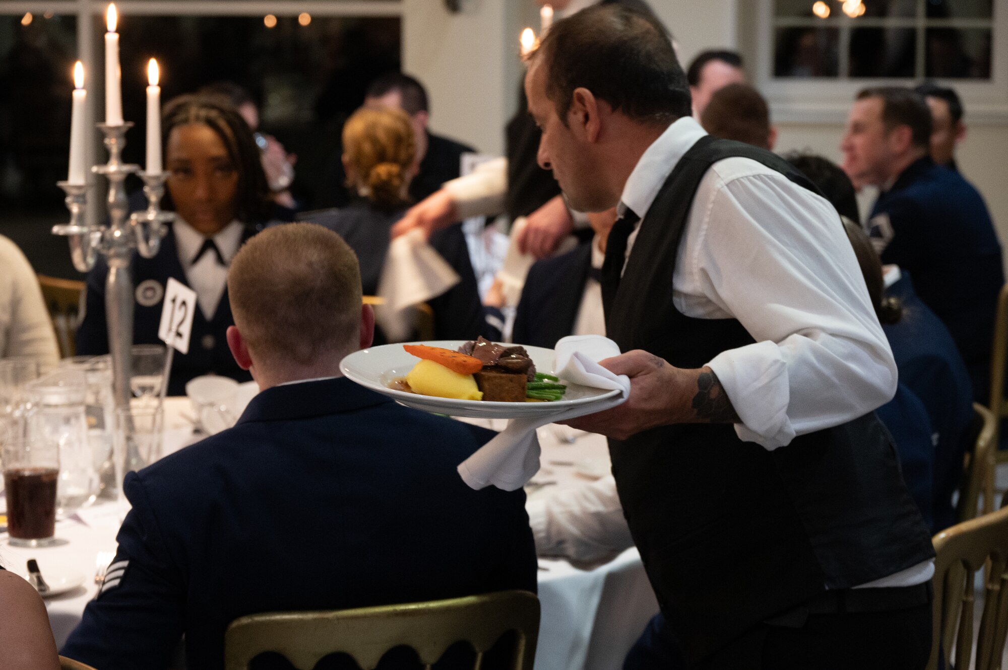 A waiter serves food