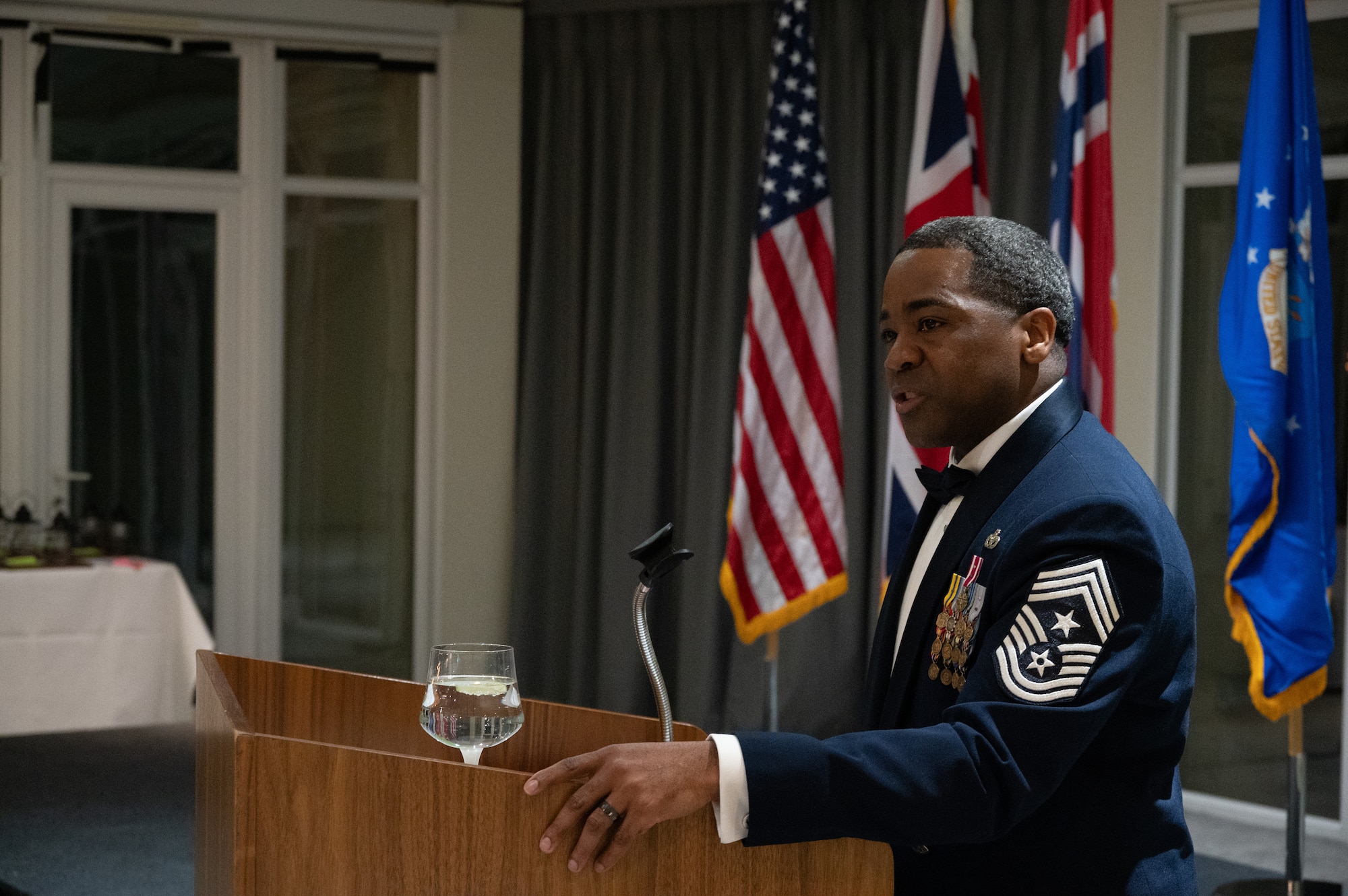 U.S. Air Force Chief Master Sgt. Terrance Boyd, 501st Combat Support Wing command chief, speaks